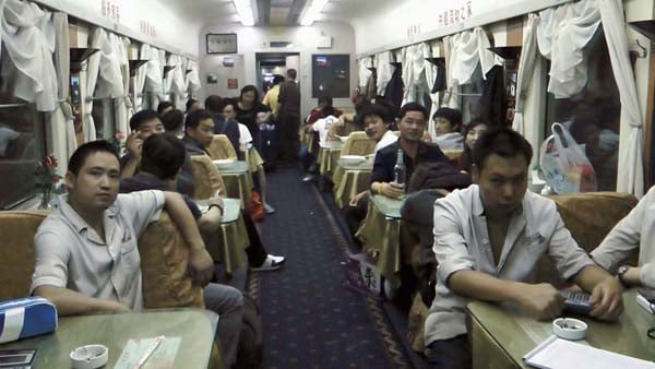 Chinese people on a crowded train car