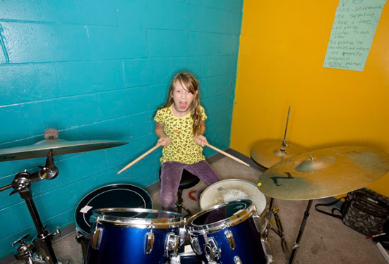 Girl on drums at rock camp