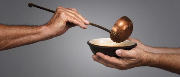 Hands serving and receiving soup