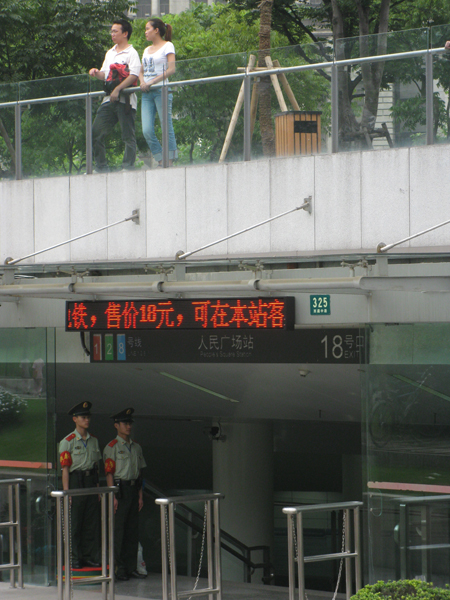 Couples at a Metro station in Shanghai