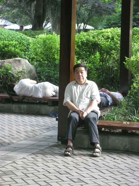 A man wakes from a nap in Shanghai