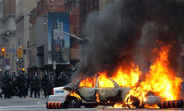 Cop car burning at G20 protest