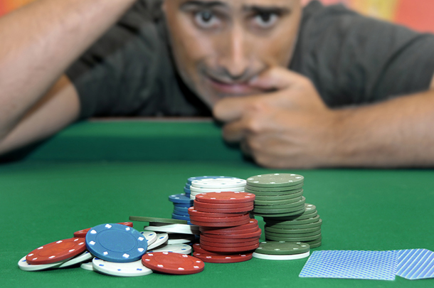 Gambler_At_Table_With_Chips