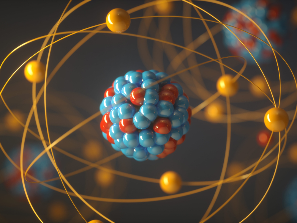 A 3-D concept image of a nuclear atom using blue, red and yellow colourways.