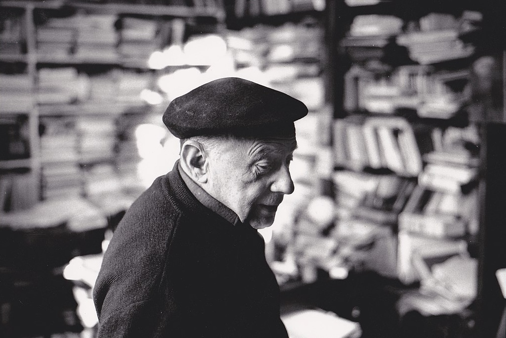 A black and white photo of a white-skinned man in dark beret.