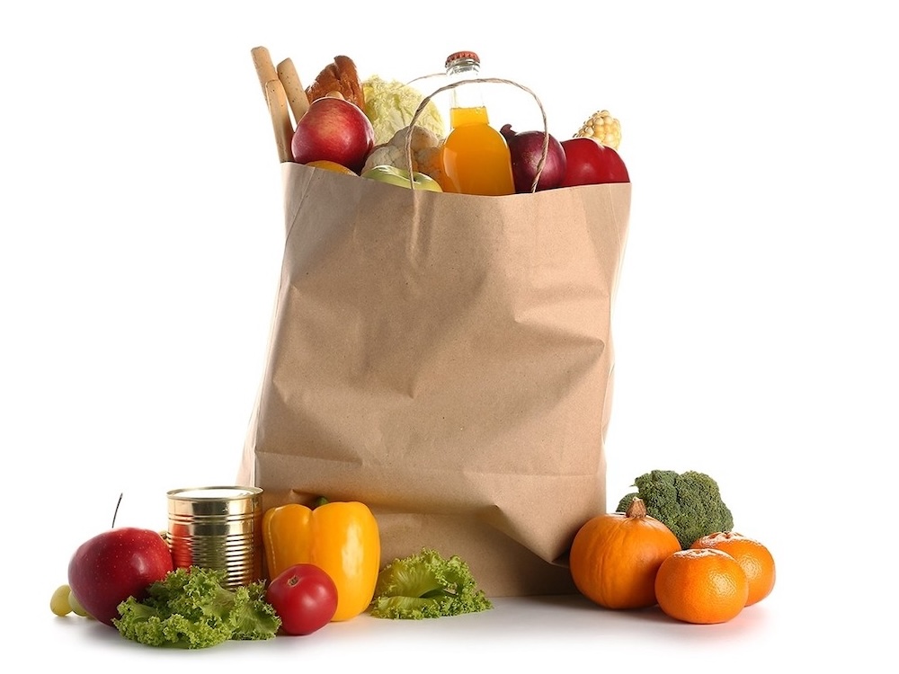 A brown paper bag full of groceries.