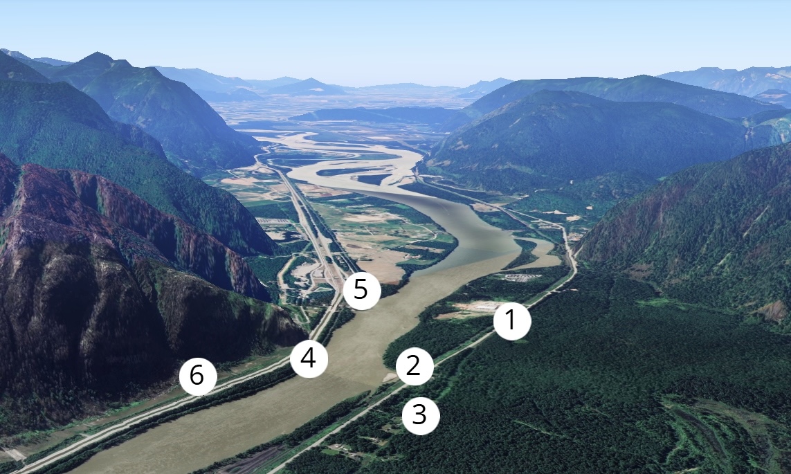 An aerial image shows a river valley with highways, pipelines and railways on either side.