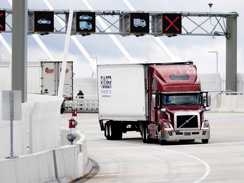 Truck traffic is shown on the Gordie Howe International Bridge that connects Windsor, Ontario, and Detroit, Michigan.