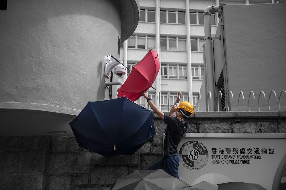 851px version of IMAGE1.Umbrella-Protester.jpg