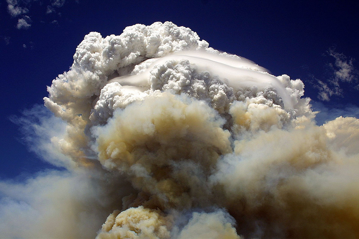 A large, billowing fire cloud in the sky.