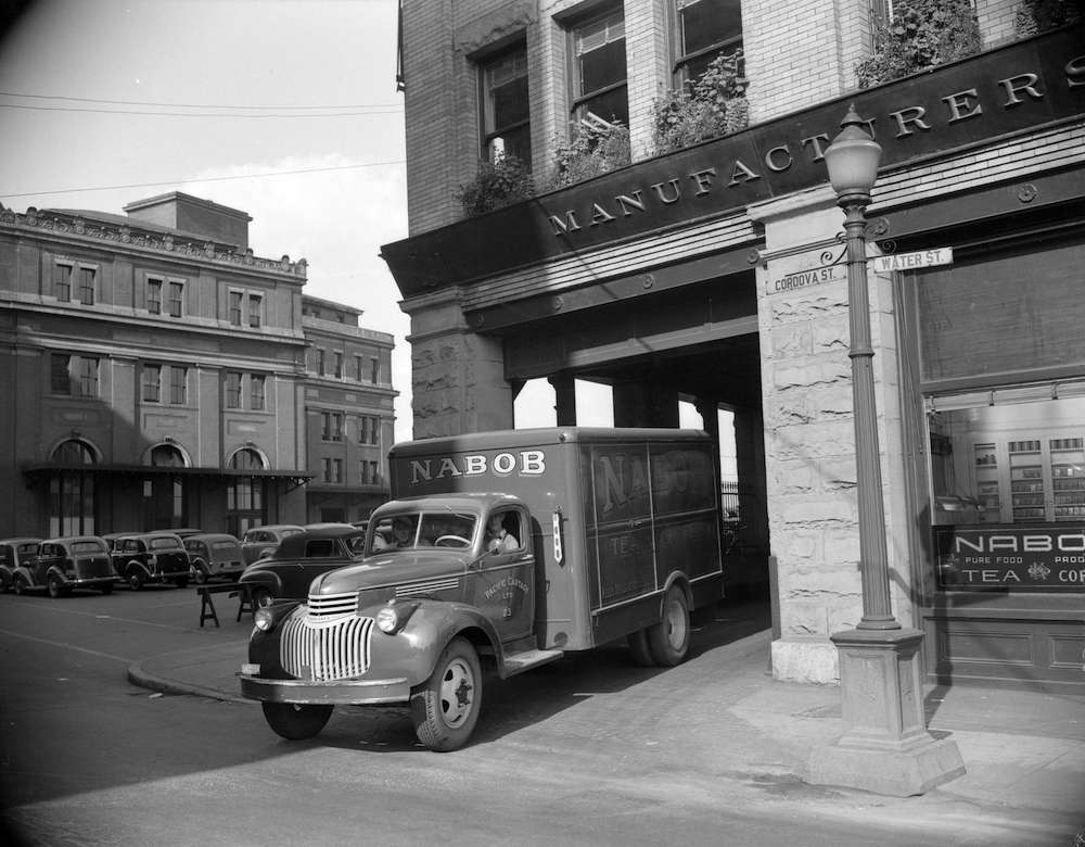 A Nabob truck pictured at Cordova and Water Streets. The photo is black and white.