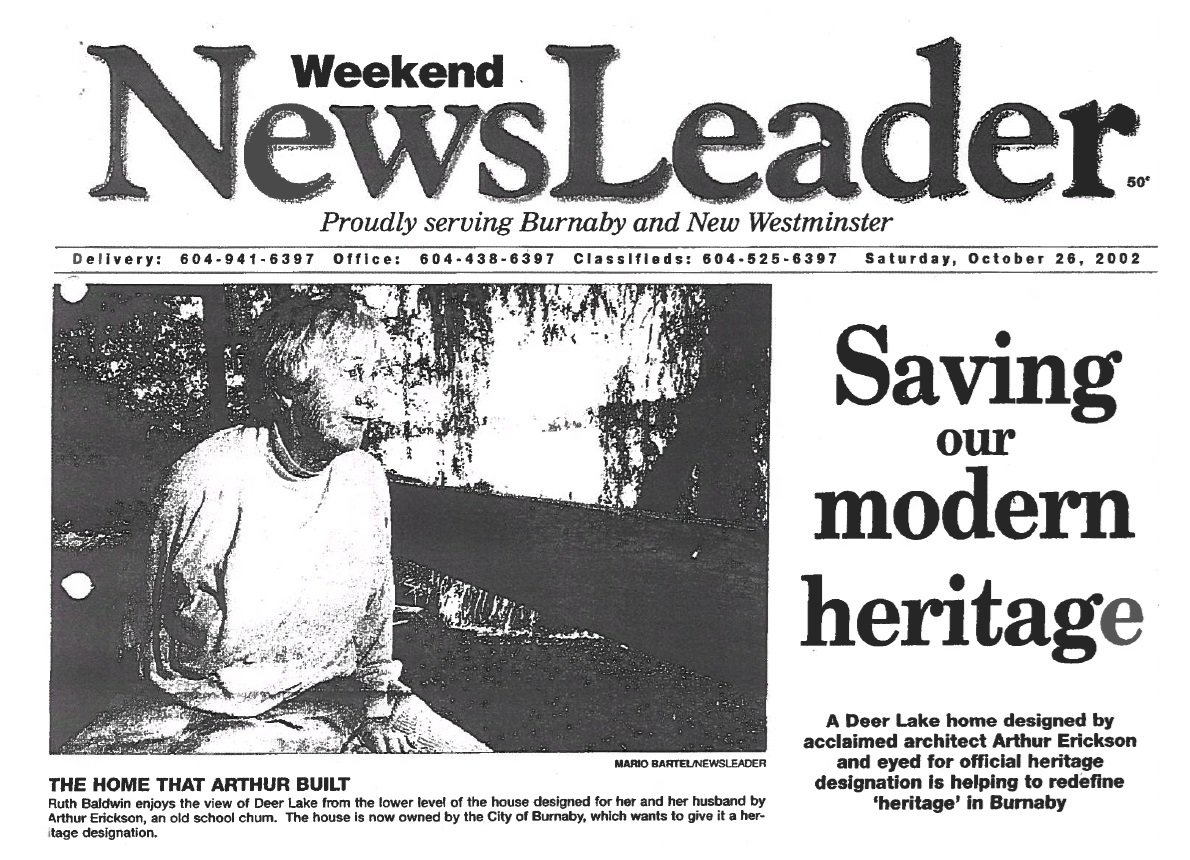 A black and white newspaper clipping from 2002. It’s not very good quality, but you can make out the photograph of an elderly woman sitting on a dock. The headline reads 'Saving Our Modern Heritage.'