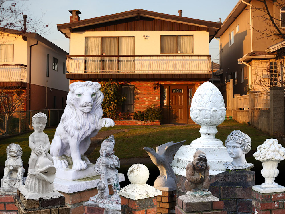 A photo collage of a Vancouver Special house at sunset with a bunch of statues in the front. A lion and a pine cone are the most prominent. Among the others are a boy riding a dolphin, a ball, a gorilla eating a banana and some classical figures.