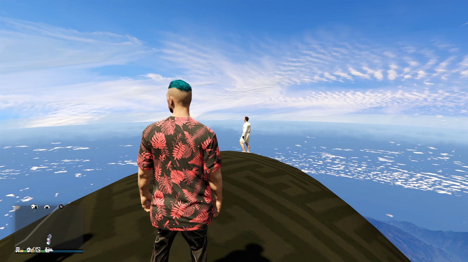 A digital illustration features two young men standing on a brown sloping landscape against a vast blue sky. They have their backs turned to the camera. The man in the foreground has short blue hair and a pink and blue graphic T-shirt. The man in the background is wearing a white long-sleeved T-shirt, white shorts and a black glove.