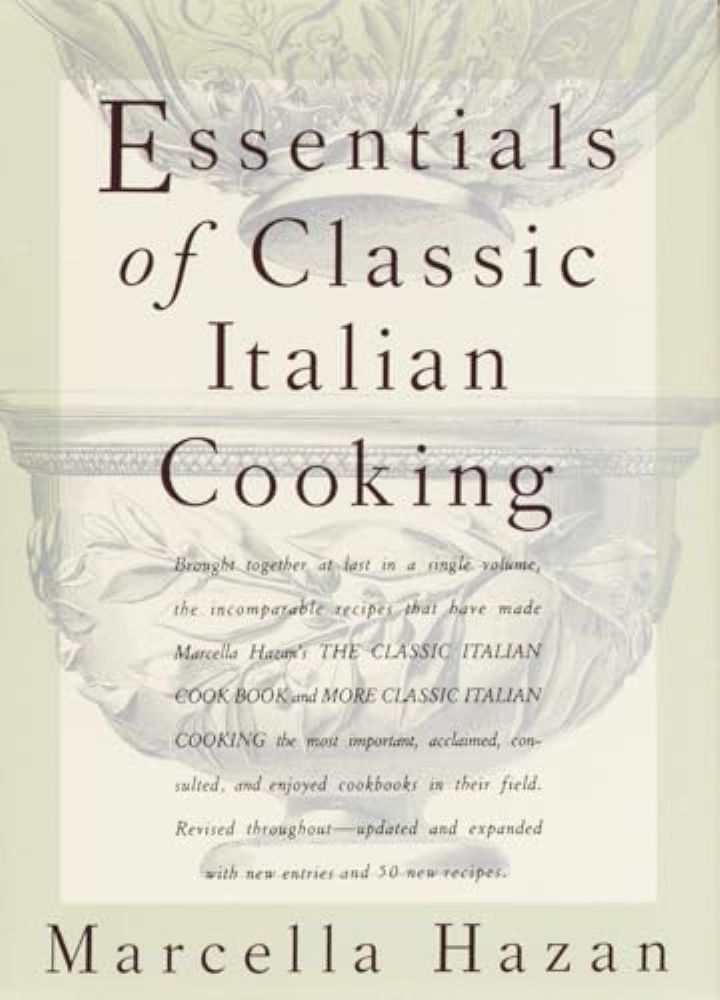 The book cover image of Marcella Hazan&rsquo;s &ldquo;Essentials of Classic Italian Cooking&rdquo; features dark serif text against a light background featuring two grey bowls decorated with the shapes of olive branches.