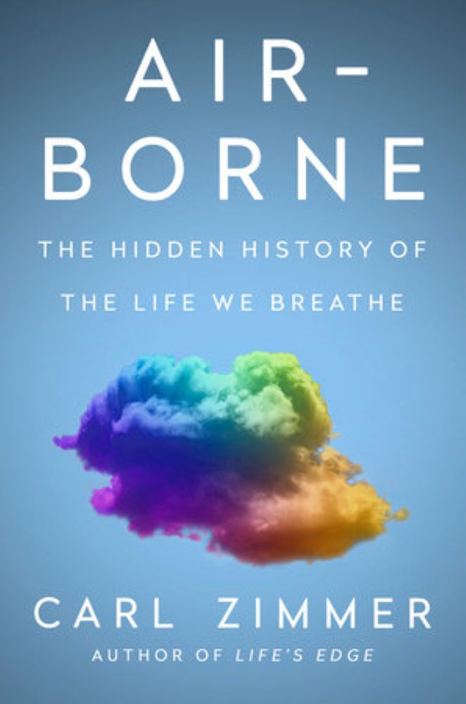 The book cover for Carl Zimmer’s “Air-Borne: The Hidden History of the Life We Breathe” features sans-serif white text against a light blue background and a colourful cloud of smoke in the middle of the frame.