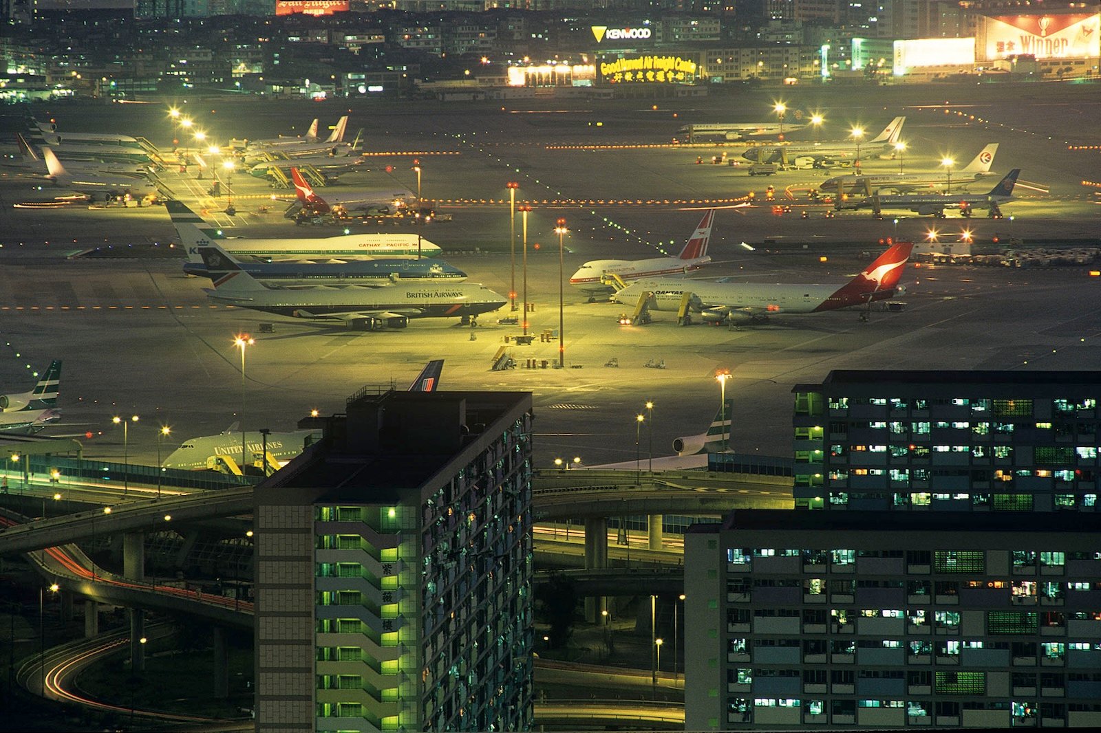 Planes are grounded at night in an airport in Hong Kong.