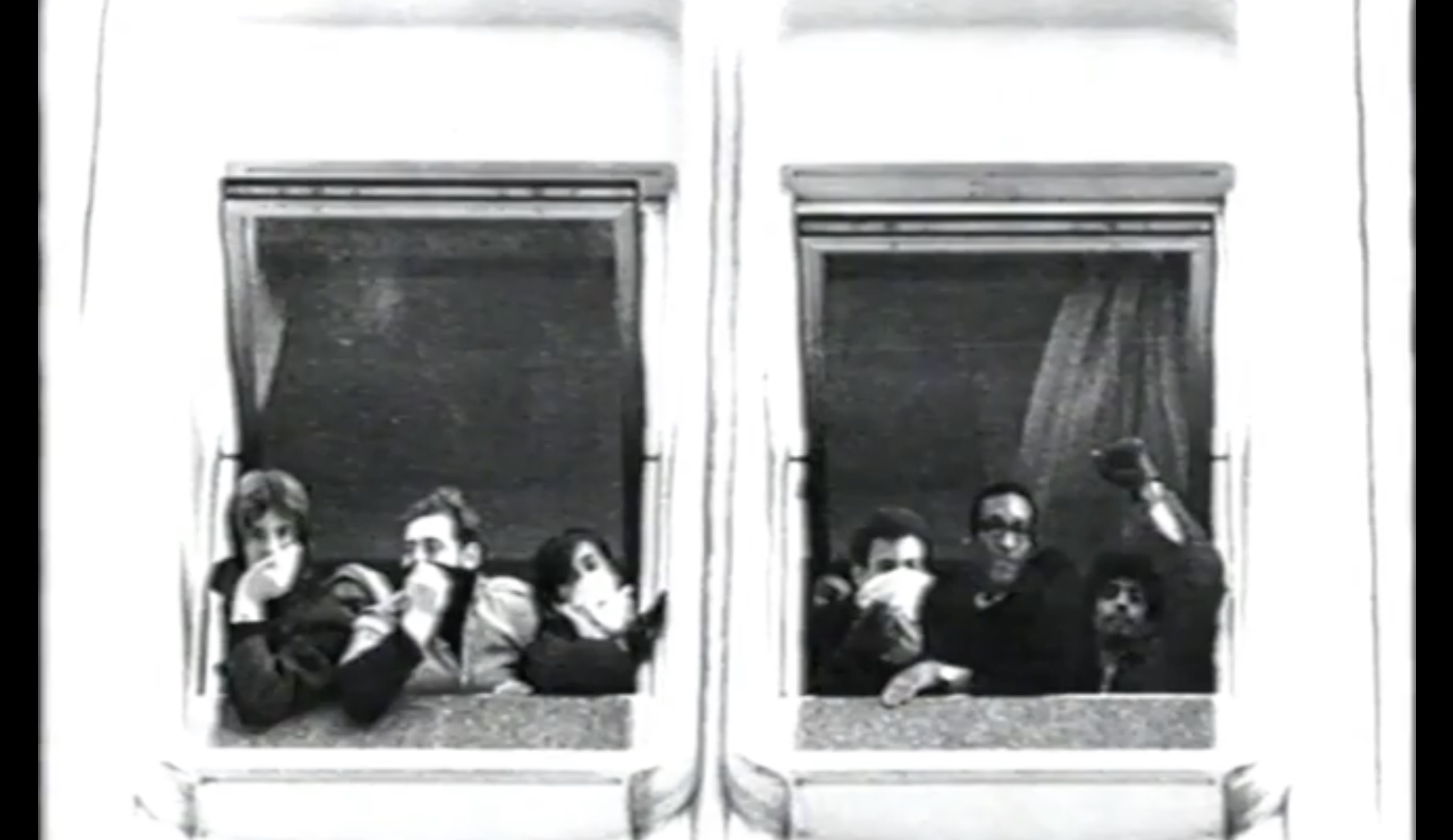 An archival black-and-white photo shows young people leaning on the sill of an open window in a tall white university building.