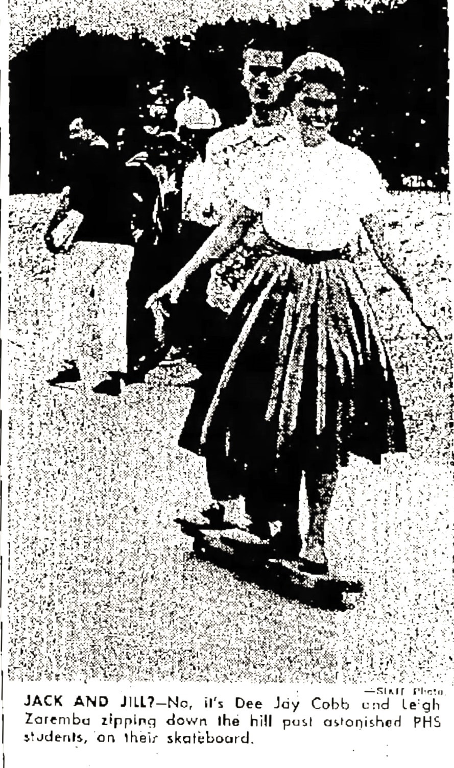 A black-and-white newspaper clipping from 1959 features a photograph of a woman with short curly hair, a white shirt and a long skirt riding a skateboard.