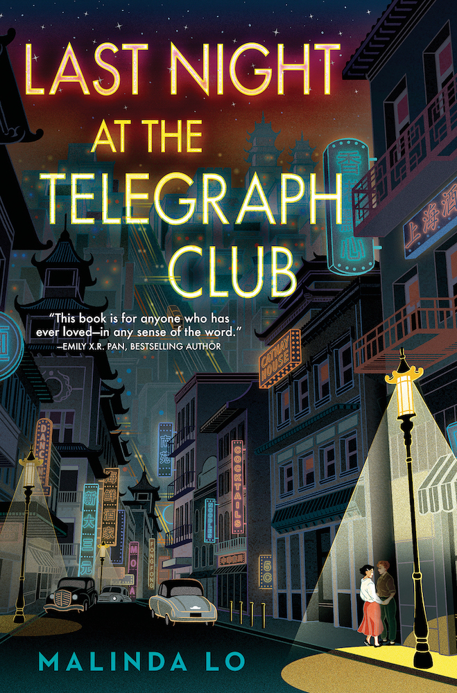 The book cover image for Malinda Lo&rsquo;s &ldquo;Last Night at the Telegraph Club&rdquo; features title text that recalls neon signage and a digital illustration of two young people holding hands in the shadows on a downtown street lit with neon signs.