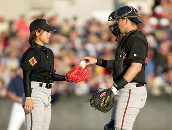 582px version of Female baseball player Eri Yoshida and catcher