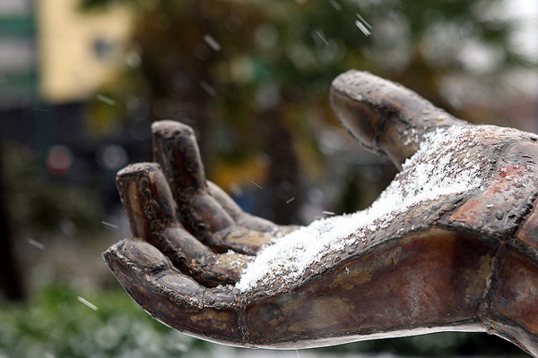 Snowy statue hand in Vancouver