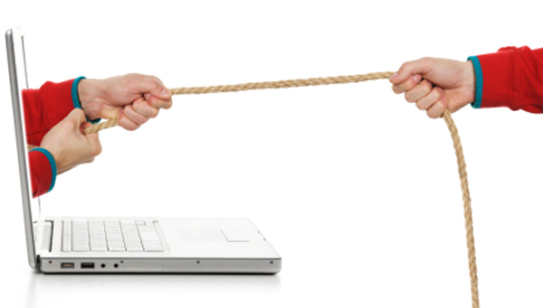 Tug of war with a laptop