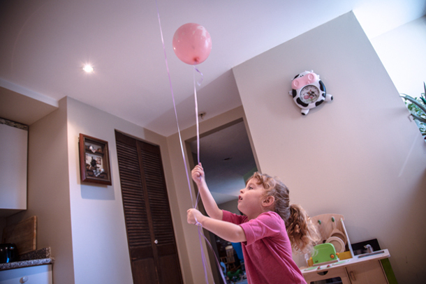 582px version of Girl playing with balloon