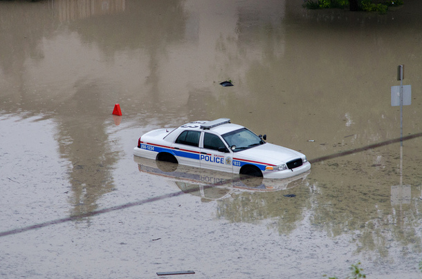 582px version of Police car trapped in the Calgary deluge