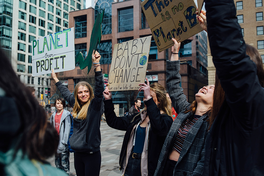 851px version of YouthClimateStrike_CrowdSigns.jpg