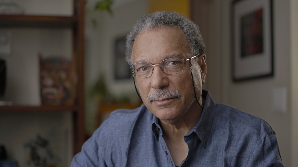 Daniel Pauly, a middle-aged Black man, looks intently at the camera.