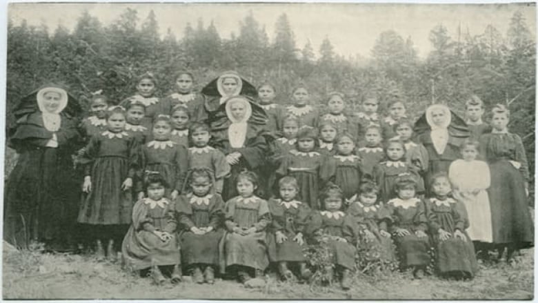 An old, black-and-white photo of a class from St. Joseph's Residential School.