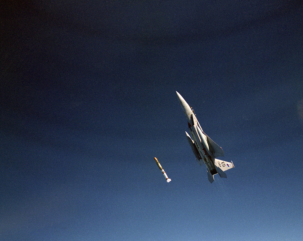 An anti-satellite missile just launched from an aircraft with the background of a blue sky.