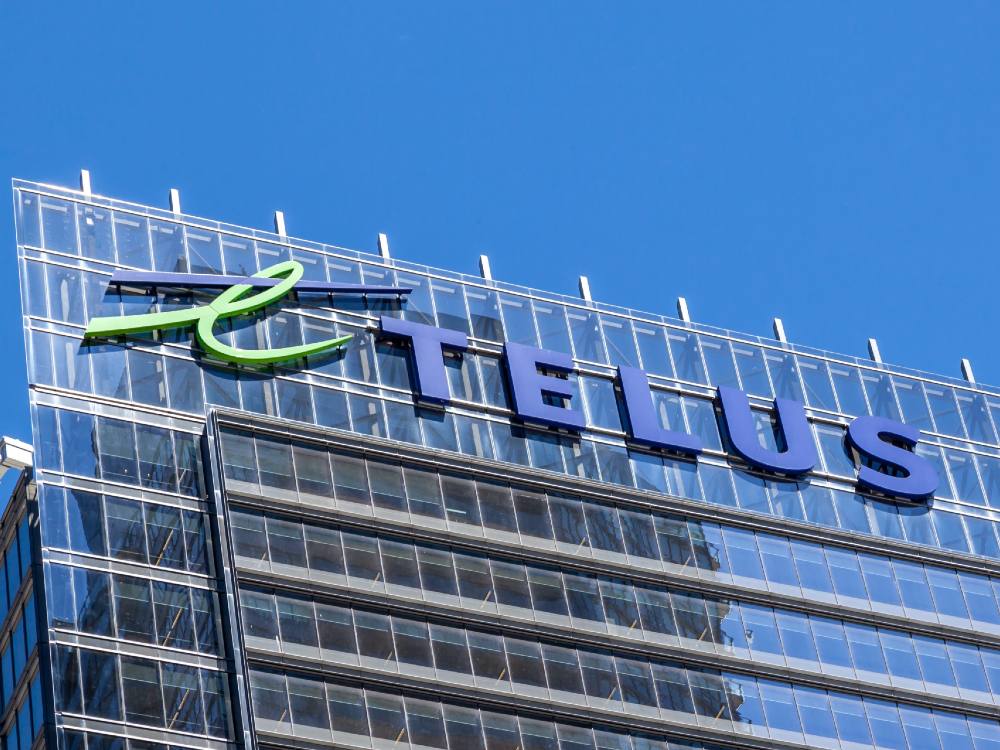 A building with the words "Telus" emblazoned on a big sign on the top.