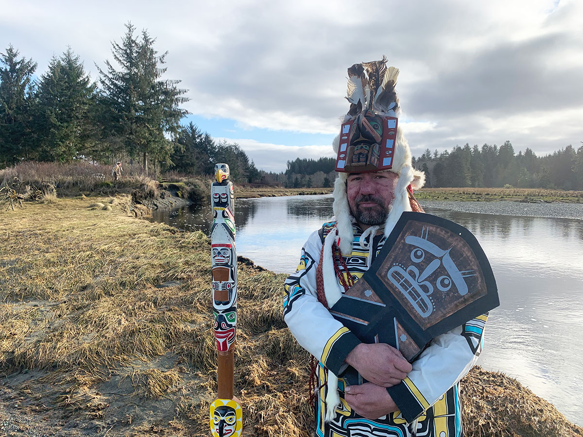 Hereditary Chief Walas 'Namugwis David Mungo Knox stands in front of the Cluxewe River, one of the major rivers in Kwakiutl Territory on northern Vancouver Island.