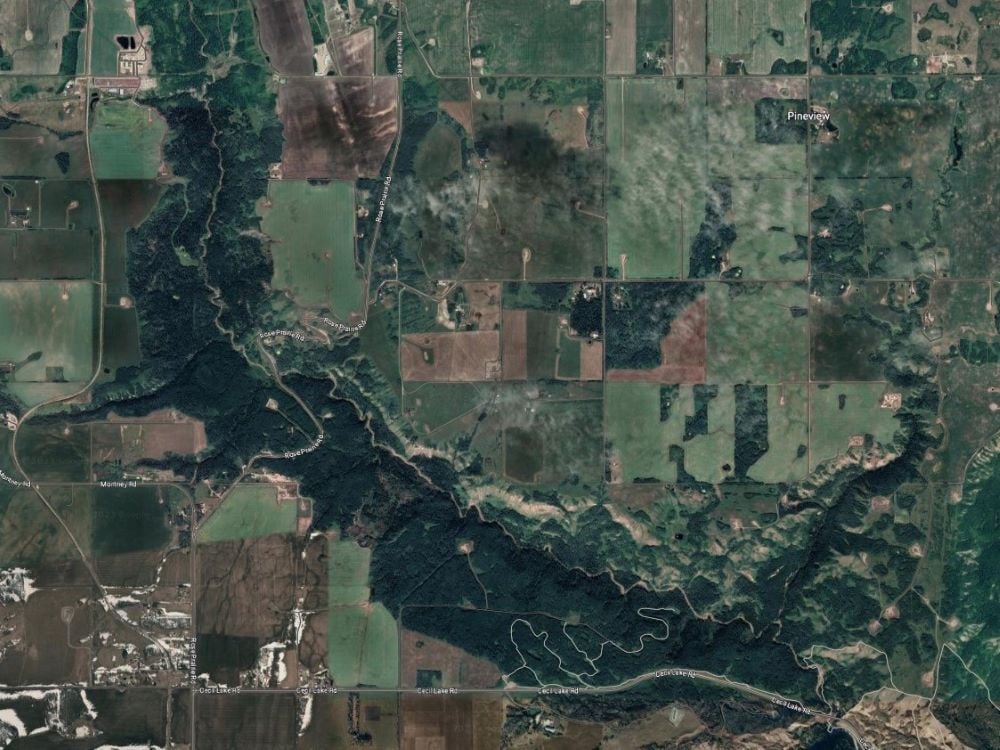 A satellite view shows the Montney River running through Gat Tah Kwą̂.