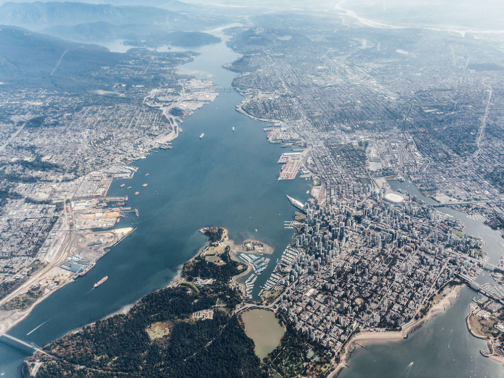 An aerial view of Burrard Inlet looking east from Stanley Park, past second narrows bridge.