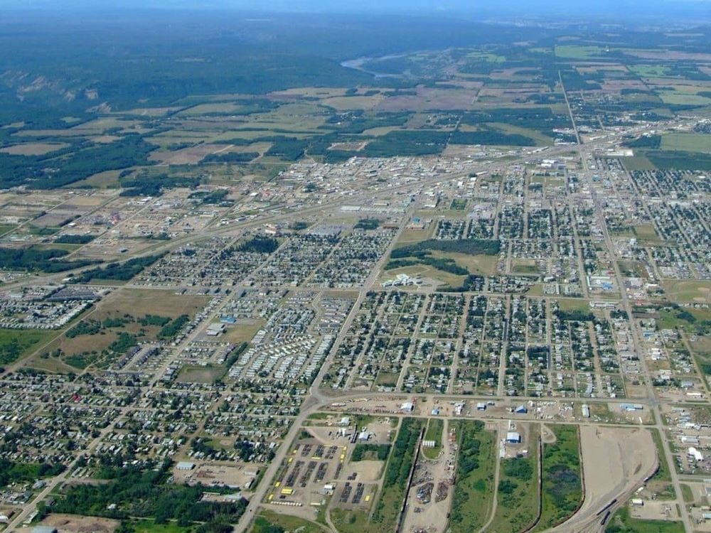 An aerial view of a small city on a flat plain.