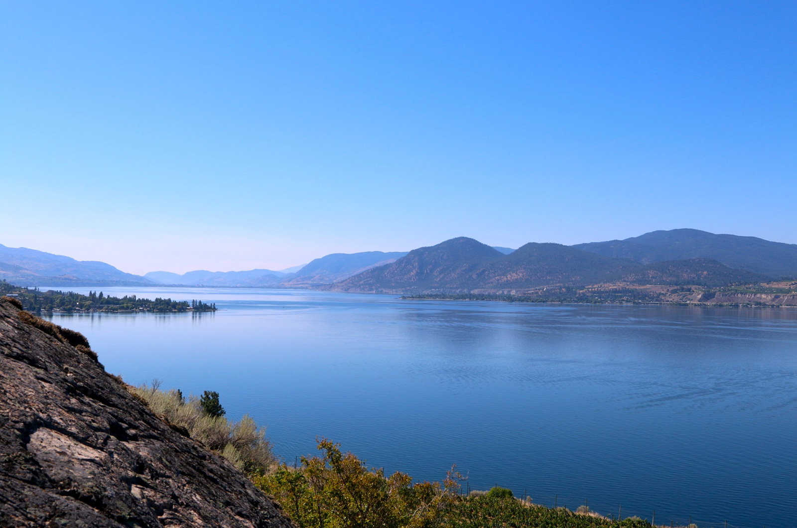 Near Penticton, BC, and a glassy-looking Kɬúsx̌nítkʷ (Okanagan Lake)