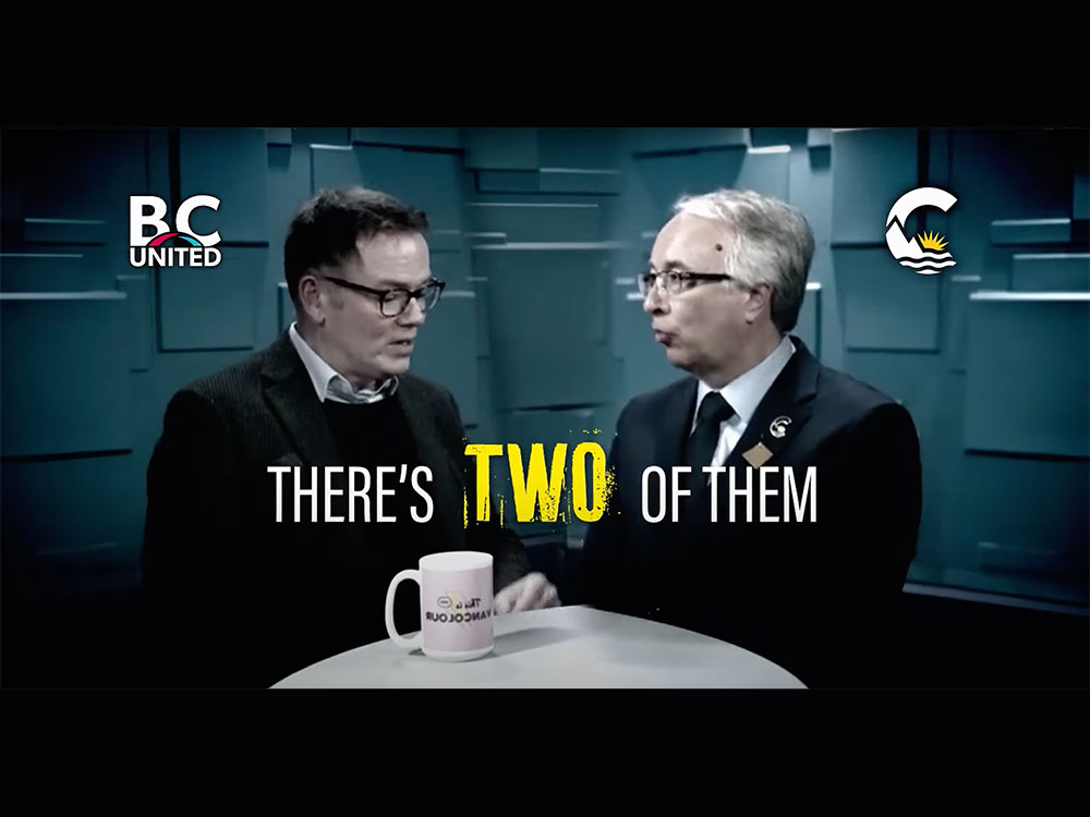 Two older men in suits sit at a table, one gesturing. Alarming letters say 'There’s two of them.'