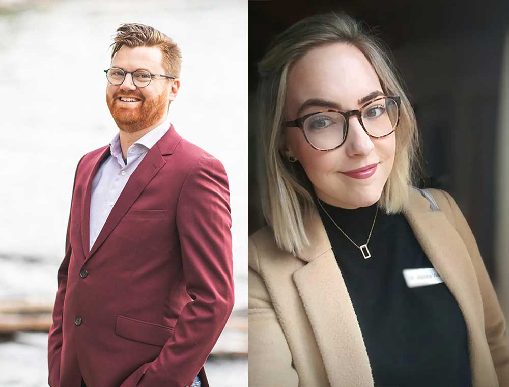 At left, a man with orange hair, light skin tone and glasses wears a burgundy suit jacket. At right, a woman with blonde hair, light skin tone and glasses wears a camel-coloured suit jacket.