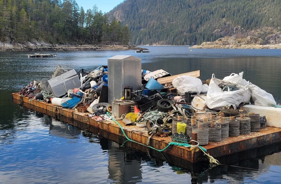 Ocean debris from aquaculture piled high on a barge.