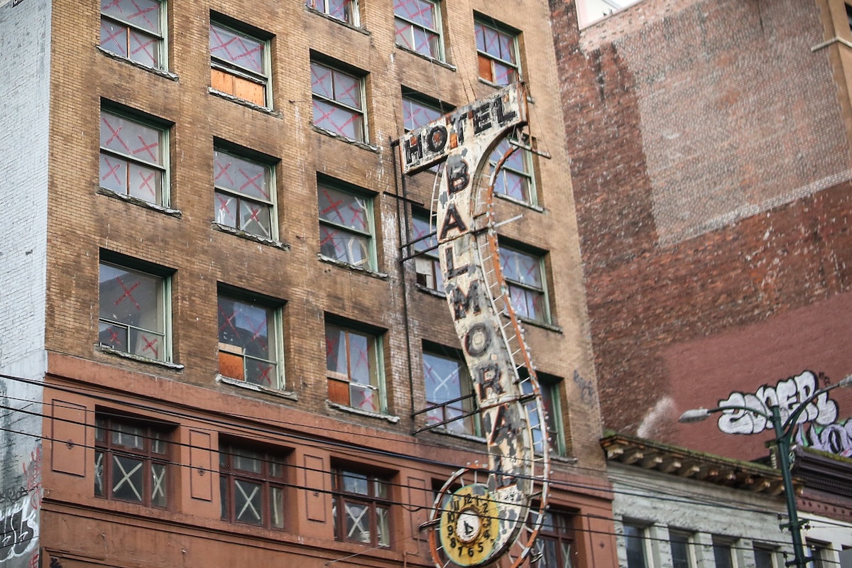 The brick Balmoral building, with its iconic sign. The windows of the building have been given double Xs.