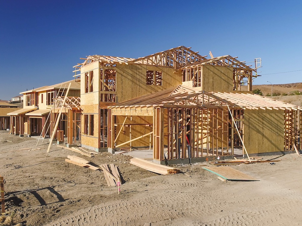 A row of houses under construction.