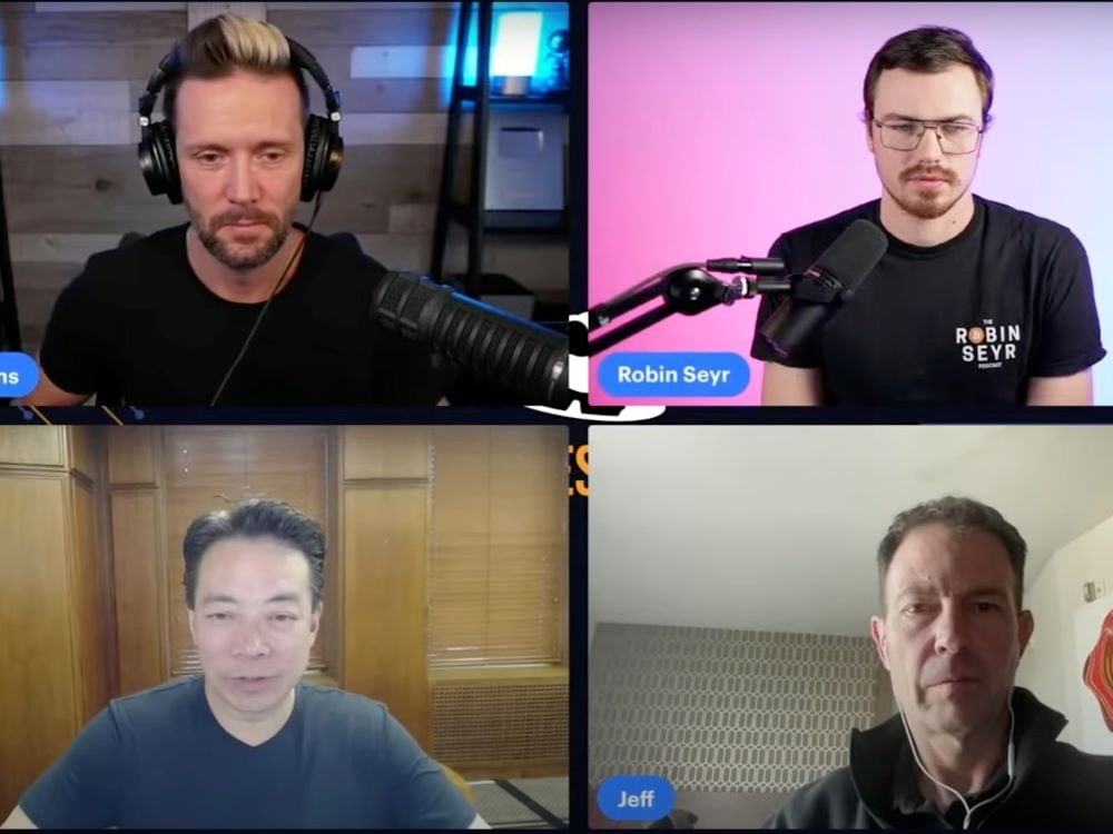 A screenshot shows four men with light-toned skin in separate locations participating in an online video session. Vancouver Mayor Ken Sim is in the lower left, wearing a black short-sleeved T-shirt in the wood-panelled mayor’s office.