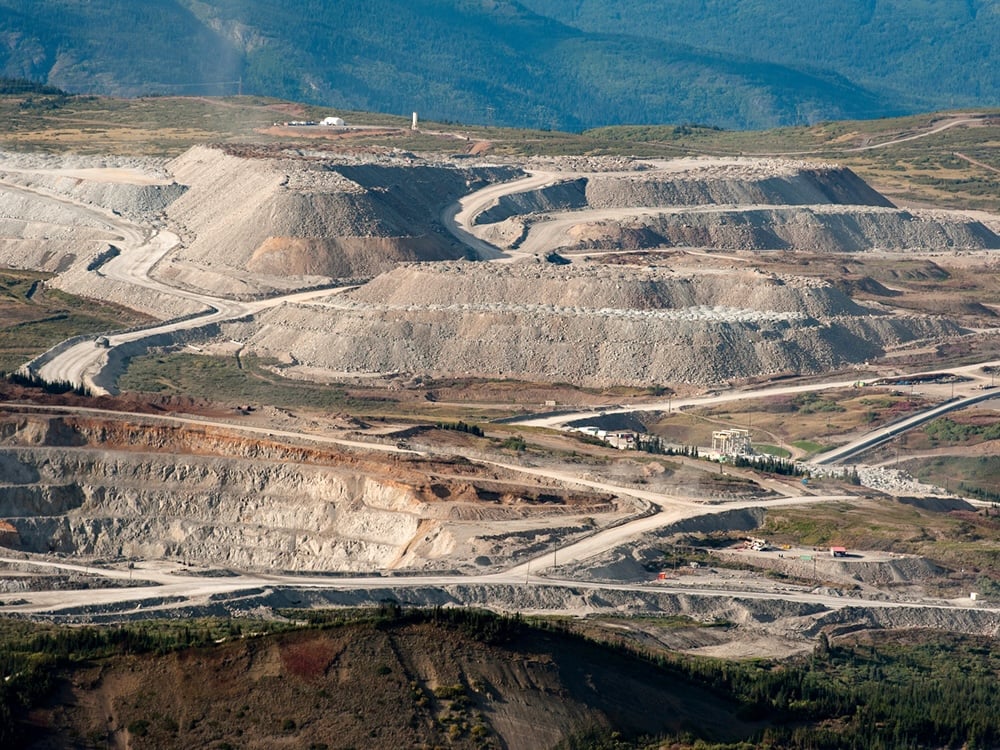 An aerial photo shows the massive open-pit operations of the Red Chris mine.