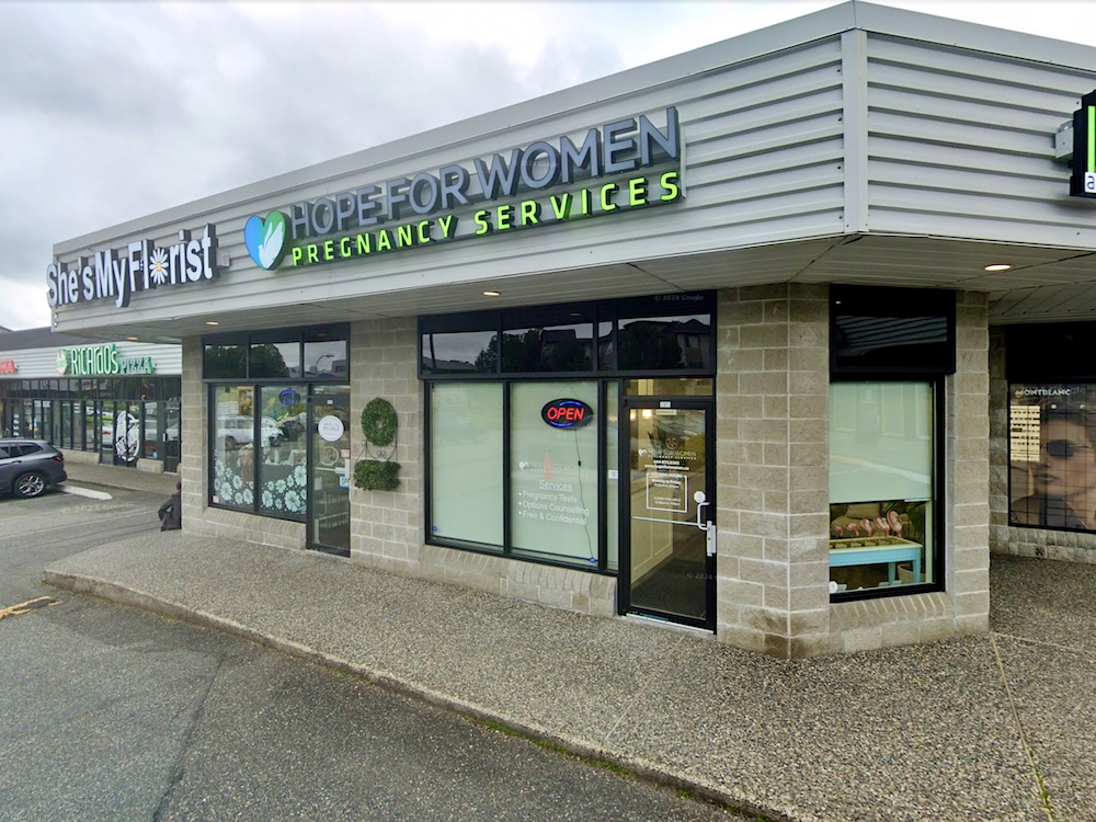 A storefront in a suburban strip mall with signage reading &lsquo;Hope for Women.&rsquo;