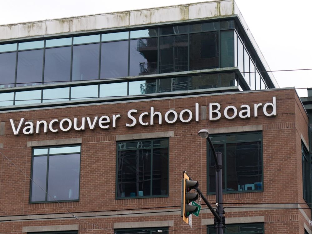 A brick building with the sign &ldquo;Vancouver School Board.&rdquo;
