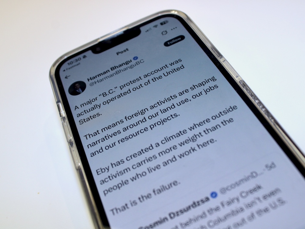An iPhone showing an X post from Conservative MLA Harman Bhangu. The post reads: &lsquo;A major &ldquo;B.C.&rdquo; protest account was actually operated outside the United States. That means foreign activists are shaping narratives around our land use, our jobs and our resource projects.&rsquo;
