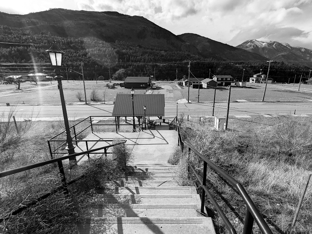 A black and white photo of Lytton&rsquo;s downtown, which has a few buildings but is still very sparsely populated.